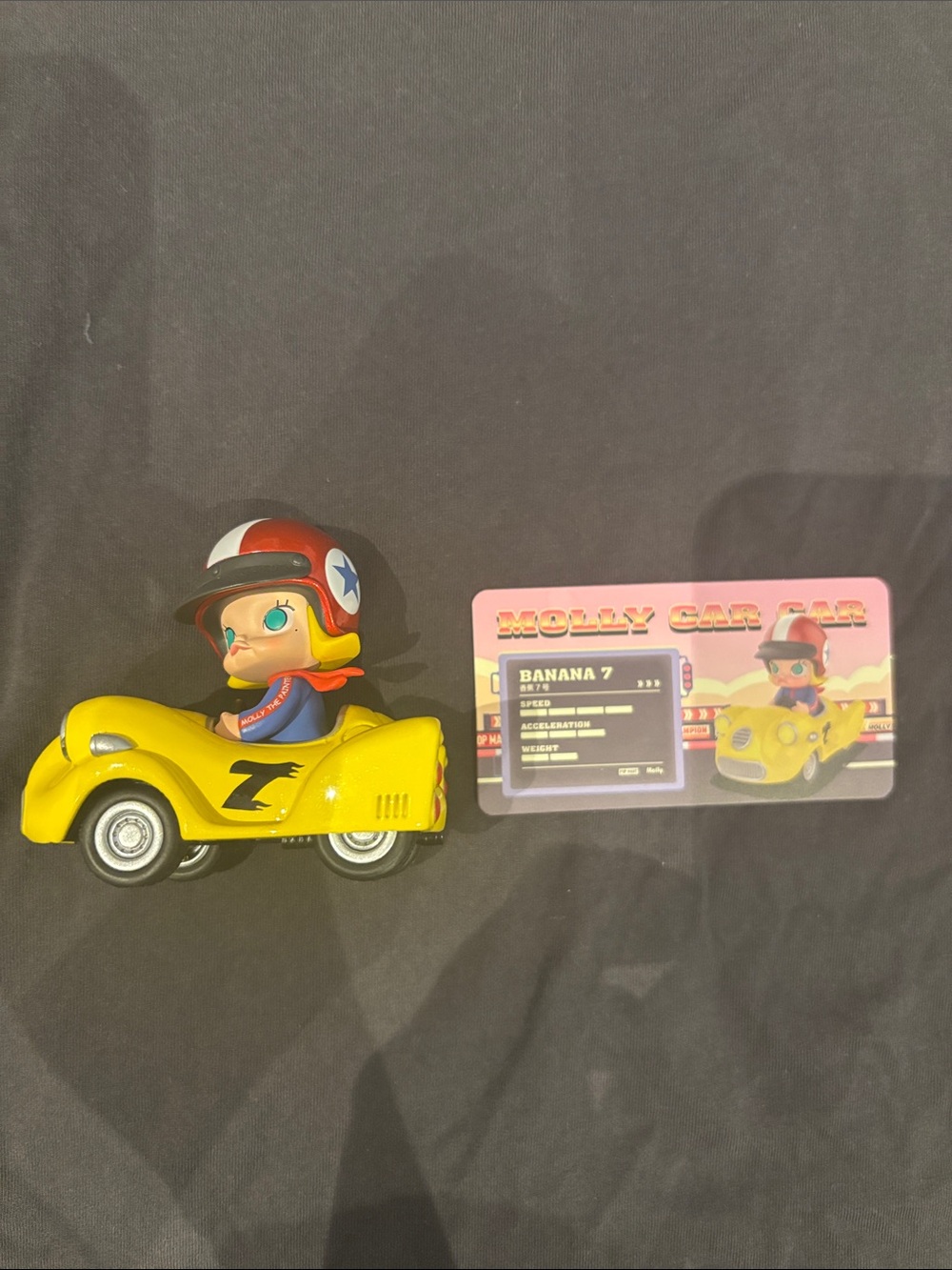 Molly Racer Figure with Yellow Roadster and Collectible Card
